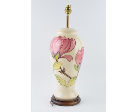 Large Moorcroft lamp base with pink floral pattern on a magnolia background, 35cm tall exc. brass fitting.  In good condition