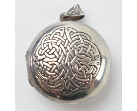 Silver 925 circular locket with Celtic design and verse to rear, 'may the road rise to meet you', 11.0 grams.  