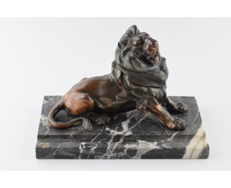 French Art Deco inkwell in the form of a lion mounted onto marble, 23cm long.  The lion is in good condition.