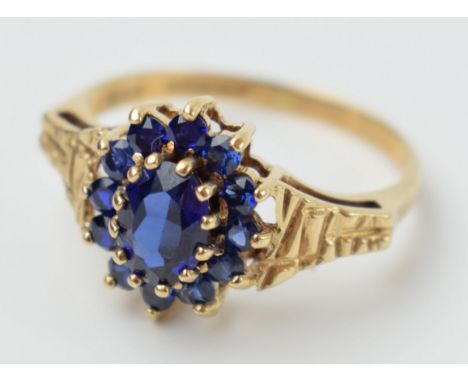 9ct gold ladies ring set with sapphires with textured shoulder, 2.6 grams, size R, in box.  