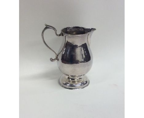 A Continental Antique silver pitcher cream jug on spreading base. Approx. 83 grams. Est. £50 - £80.