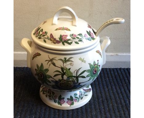 A massive Portmeirion punch bowl together with ladle. Approx. 30 cms high. Est. £40 - £60.