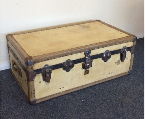 A stylish velum trunk with locking mechanism. Est. £25 - £35.
