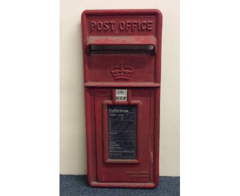 A cast iron Post Office 'E II R' red painted letter box mount. Approx. 60 cms x 25 cms. Est. £50 - £80.