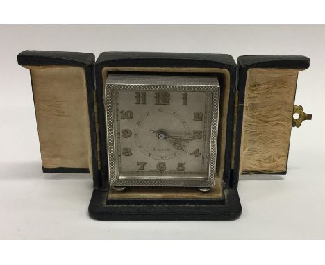 A good quality engine turned silver travelling clock with silvered dial. Birmingham. Approx. 290 grams. Est. £100 - £150.