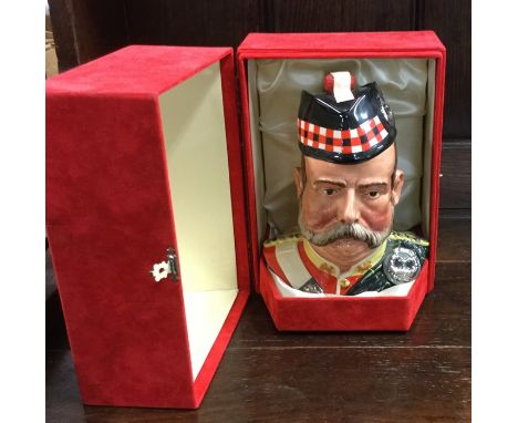 A Royal Doulton character jug containing Grant's 25 Year Old Very Rare Scotch whisky in the shape of a Scots Guard with barre