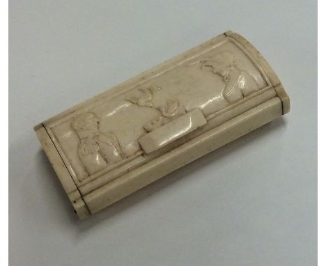An Antique ivory snuff box with hinged top decorated with figures. Est. £25 - £35.