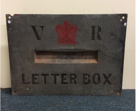A Victorian 'V R' cast letter box plaque with crown centre. Approx. 56 cms x 41 cms. Est. £150 - £250.