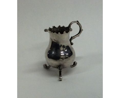 A rare miniature 18th Century Dutch ewer with scroll handle. Marked to base. By Arnoldus van Geffen. 1768. Approx. 24 grams. 