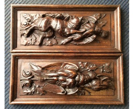 A good pair of rectangular wooden panels mounted with hunting and game in high relief. Approx. 28 cms x 62 cms each. Est. £30