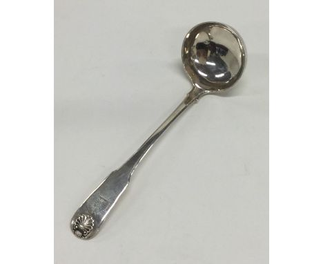 A small Scottish silver fiddle pattern cream ladle. Approx. 30 grams. Est. £30 - £40.