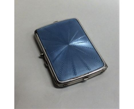 A silver and enamel compact with mirrored interior and hinged top. Approx. 175 grams. Est. £80 - £120.