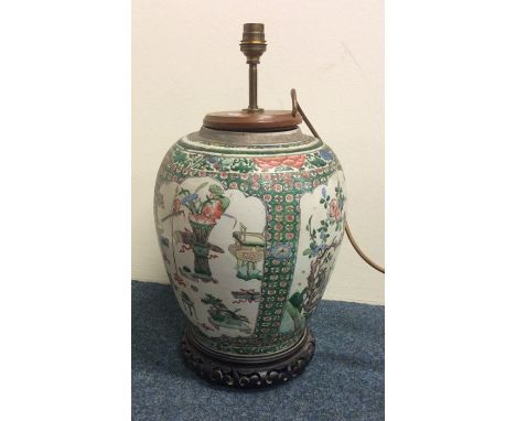 An Antique Chinese lamp attractively decorated with birds and figures. Est. £200 - £300.