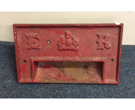 A red painted cast iron Royal Mail 'E II R' letter box mount. Est. £30 - £50.