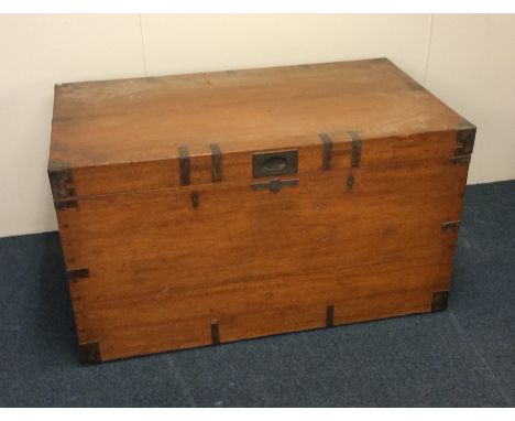 A large brass mounted Military trunk. Est. £60 - £80.