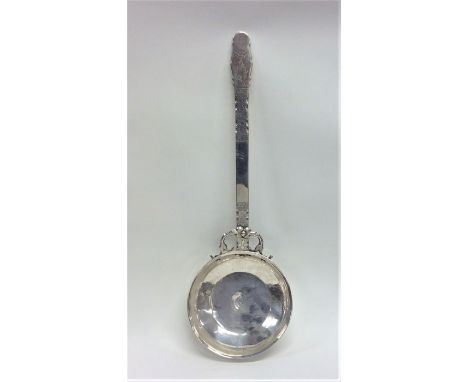 A massive Swedish silver ladle with engraved decoration. Punched to base. Approx. 278 grams. Est. £200 - £300.