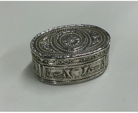 A heavy oval silver snuff box / vesta case attractively decorated with swags and scrolls. Import marks for Chester 1902. Appr