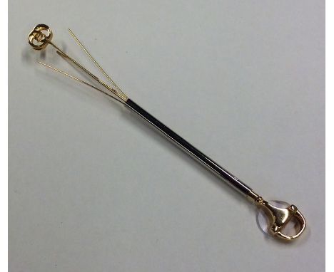 GUCCI: A fancy swizzle stick of tapering form. Est. £50 - £80.