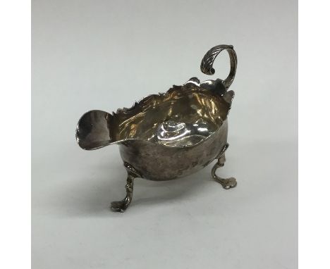 A small Georgian silver sauce boat. London. By R Cox. Approx. 94 grams. Est. £80 - £120.