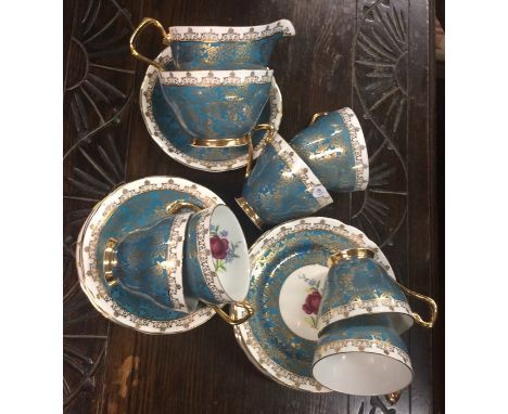 A Windsor blue and gilt tea service decorated with flowers. Est. £20 - £30.