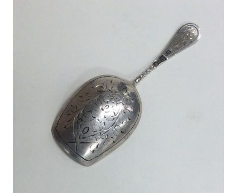 A large Russian silver caddy scoop with twisted terminal. Approx. 12 grams. Est. £40 - £60.