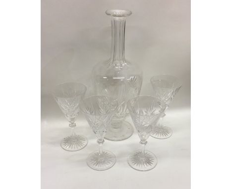 A set of four cut glass spirit glasses together with a matching decanter. Est. £20 - £30.