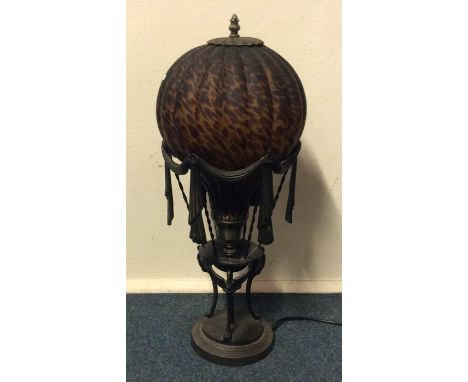 An unusual glass mounted lamp in the form of a balloon on circular spreading base. Est. £30 - £50.