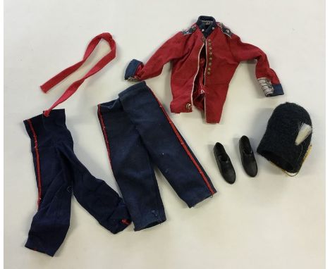 ACTION MAN: An old 'Life Guard's’ blue and red Grenadier Guard’s uniform with bearskin and shoes. Est. £25 - £35.