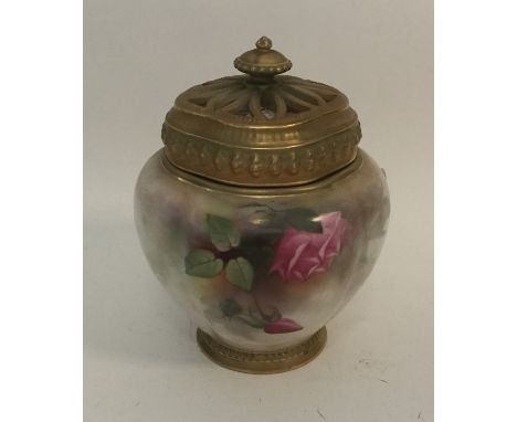 A Royal Worcester pot pourri decorated with flowers and gilding with lift-off cover. Est. £30 - £50.