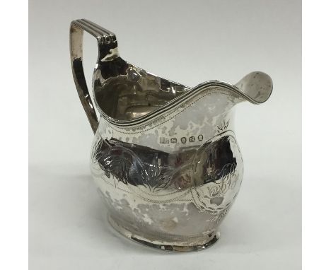 A Georgian silver helmet shaped cream jug with reeded rim. London. By SD&amp;ED. Approx. 100 grams. Est. £55 - £65.