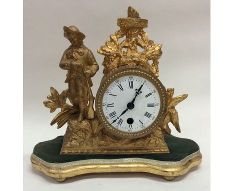 A French mantle clock with white enamel dial contained within a glass dome. Est. £60 - £80.