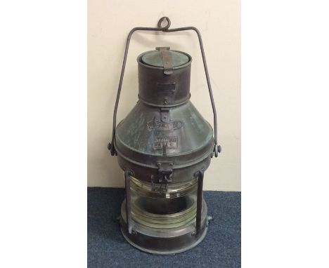 A large copper mounted ship's lamp, entitled, "Not Under Command". Est. £100 - £150.
