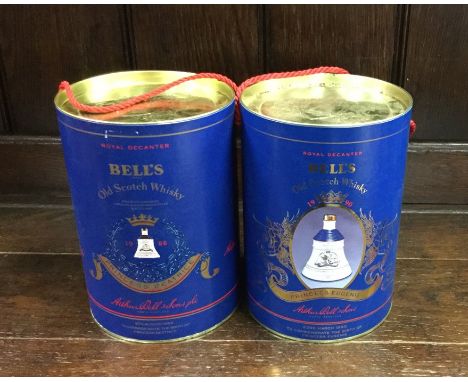 Two x cylindrical boxed Bell's Old Scotch Whiskys in commemorative Wade decanters. (2)