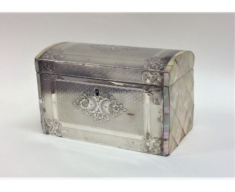 A large silver and MOP casket with hinged top decorated with flowers and engine turning. London. By CB. Approx. 287 grams. Es