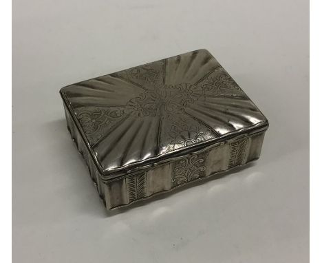 An unusual German silver hinged top snuff box decorated with flowers and leaves. Approx. 90 grams. Est. £200 - £300.