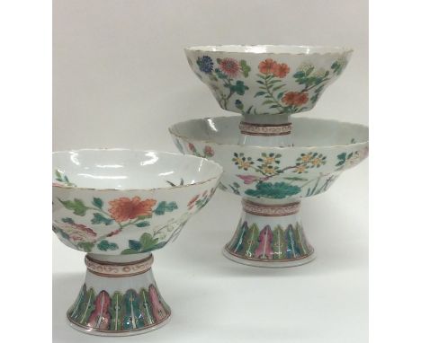 A good Chinese garniture of one large and two smaller sweet dishes attractively decorated with flowers and leaves. Seal marks
