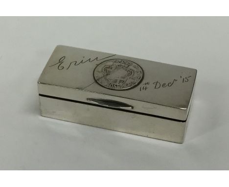 A heavy rectangular silver snuff box with coin decoration to hinged lid. Approx. 86 grams. Est. £100 - £150.