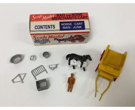 A boxed Scale Model Rag and Bone Merchants Cart complete with horse, cart, man and junk. Est. £10 - £15.