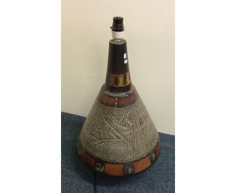 CELTIC POTTERY: A tall stylish lamp of textured form. Est. £30 - £50.