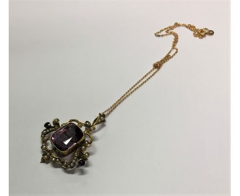 An amethyst and pearl pendant on fine link chain. Approx. 7 grams. Est. £100 - £150.