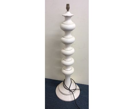 A stylish tall pottery lamp of bulbous form. Approx. 100 cms high. Est. £30 - £50.