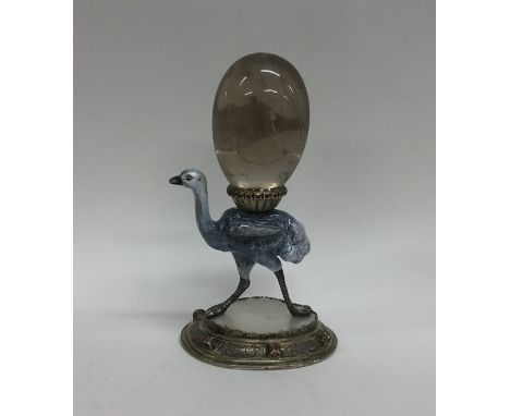 An unusual enamel centrepiece in the form of an ostrich with gemstone base. Approx. 12 cms high. Approx. 211 grams. Est. £600
