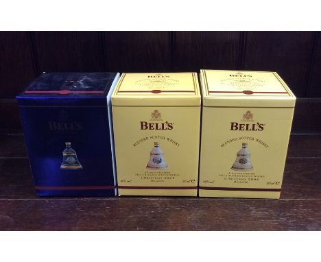 Two boxed Bell's Blended Scotch Whiskys in Christmas Wade Decanters dated 2005 and 2006, together with one other boxed Extra 