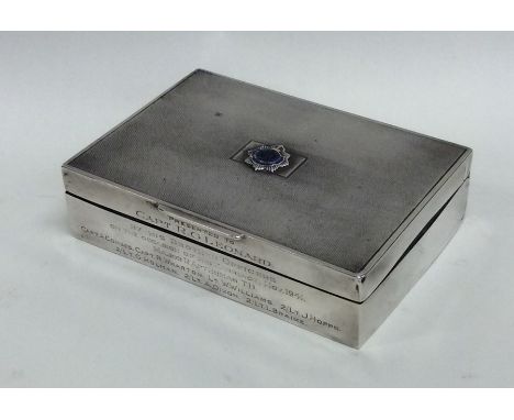 A silver cigarette box presented to Capt R G Leonard, Nov 1941. Approx. 284 grams. Est. £40 - £50.