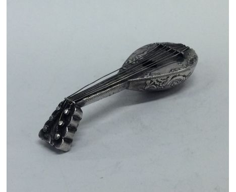 A Continental embossed silver mandolin decorated with flowers and leaves. Approx. 40 grams. Est. £60 - £80.