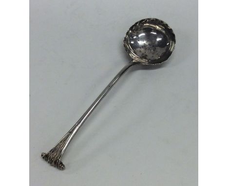 A Georgian silver onslow pattern ladle with crimped rim. Approx. 67 grams. Est. £60 - £80.