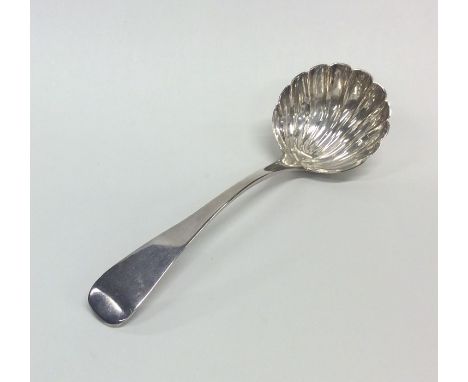 A Georgian silver OE pattern ladle with fluted bowl. London. By WJ. Approx. 61 grams. Est. £35 - £45.