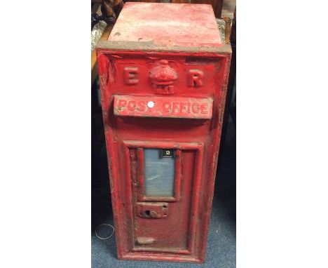 A large Royal Mail  'E II R' red cast iron letter box. Approx. 72 cms x 27 cms. Est. £150 - £250.