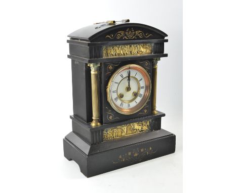 19th century black slate mantle clock of classical design having moulded brass frieze and columns, enamelled dial, French chi