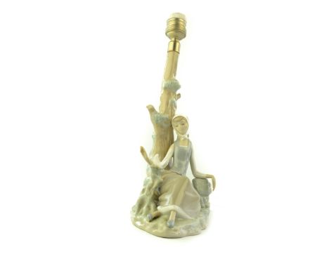 Lladro ceramic table lamp base of a seated woman and dove. [35cm high approx) 